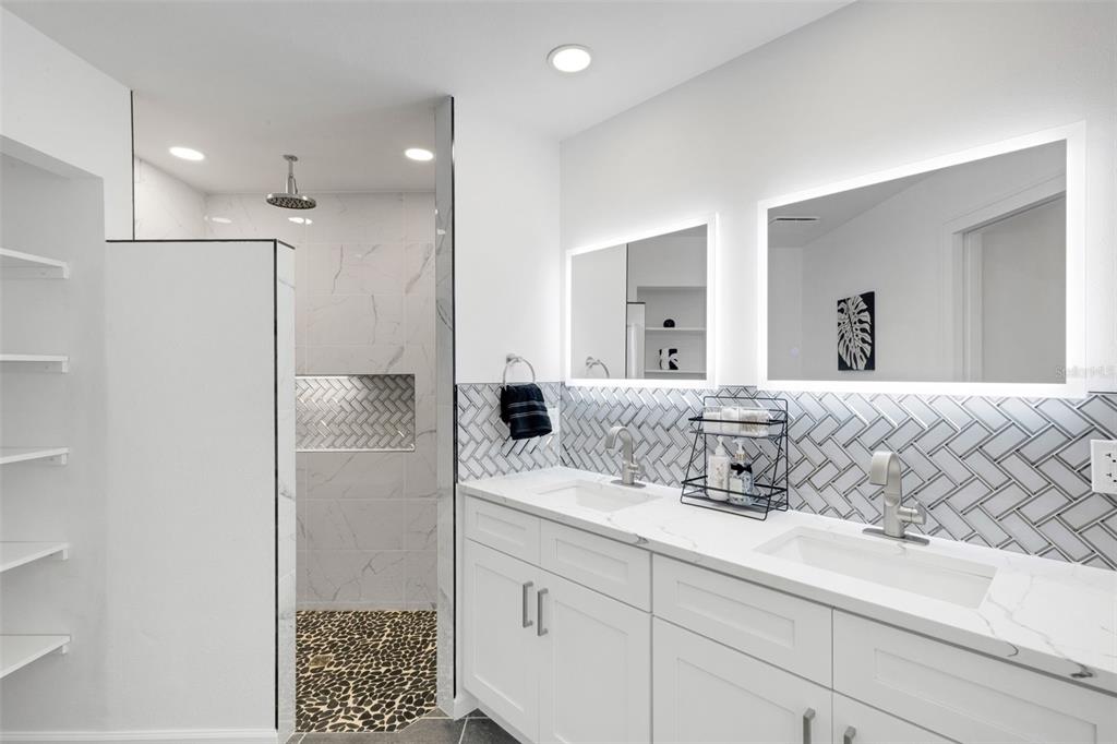 606 Marcus Street, Unit 26 Venice, FL 34285 - Photo 24 of 42 a bathroom with a sink and a mirror