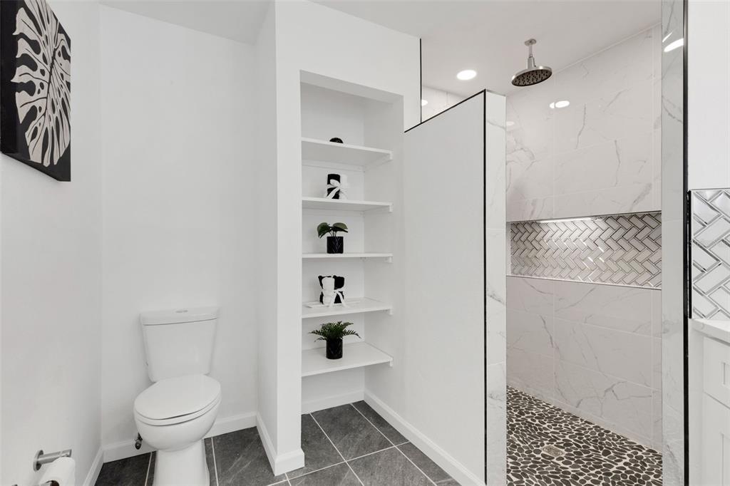 606 Marcus Street, Unit 26 Venice, FL 34285 - Photo 25 of 42 a bathroom with a sink a toilet and shower