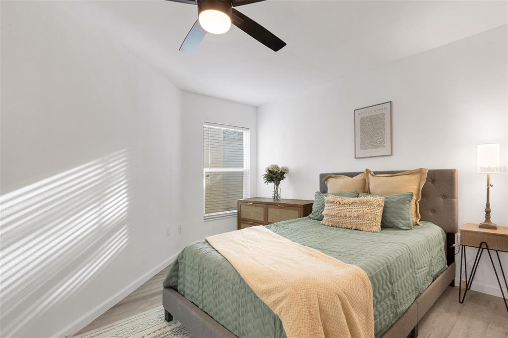 606 Marcus Street, Unit 26 Venice, FL 34285 - Photo 29 of 42 a bedroom with a bed and a window