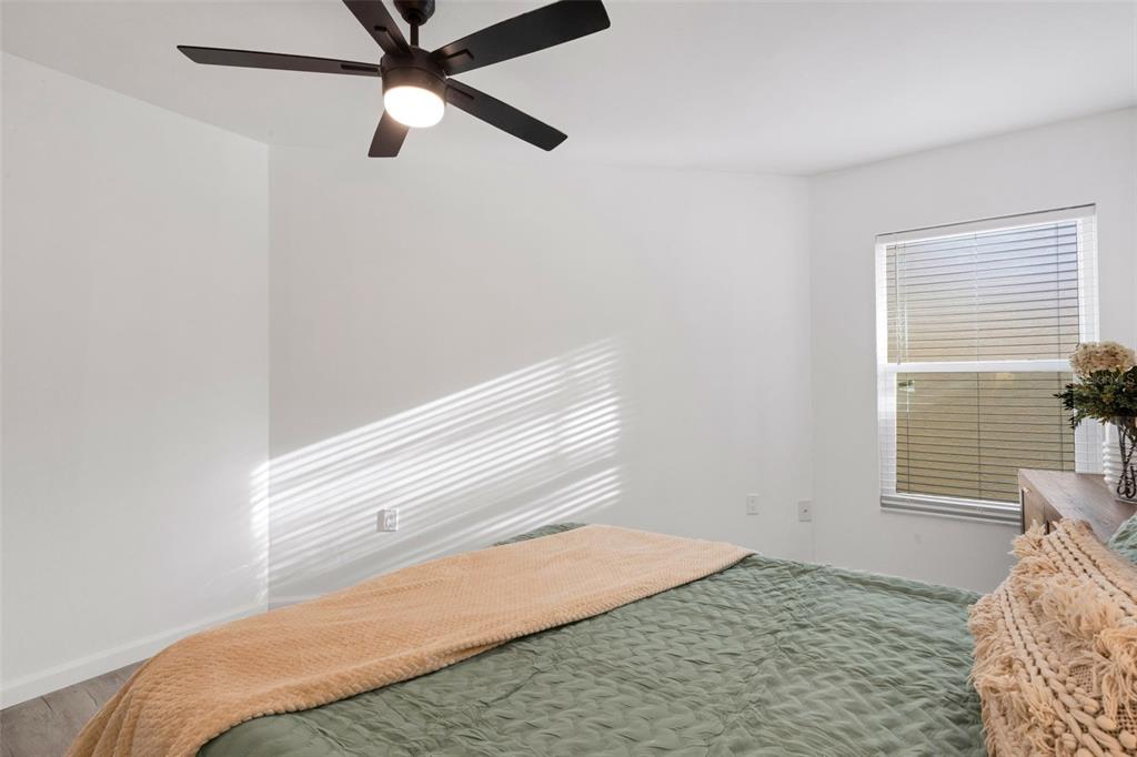 606 Marcus Street, Unit 26 Venice, FL 34285 - Photo 30 of 42 a bedroom with a bed and a window