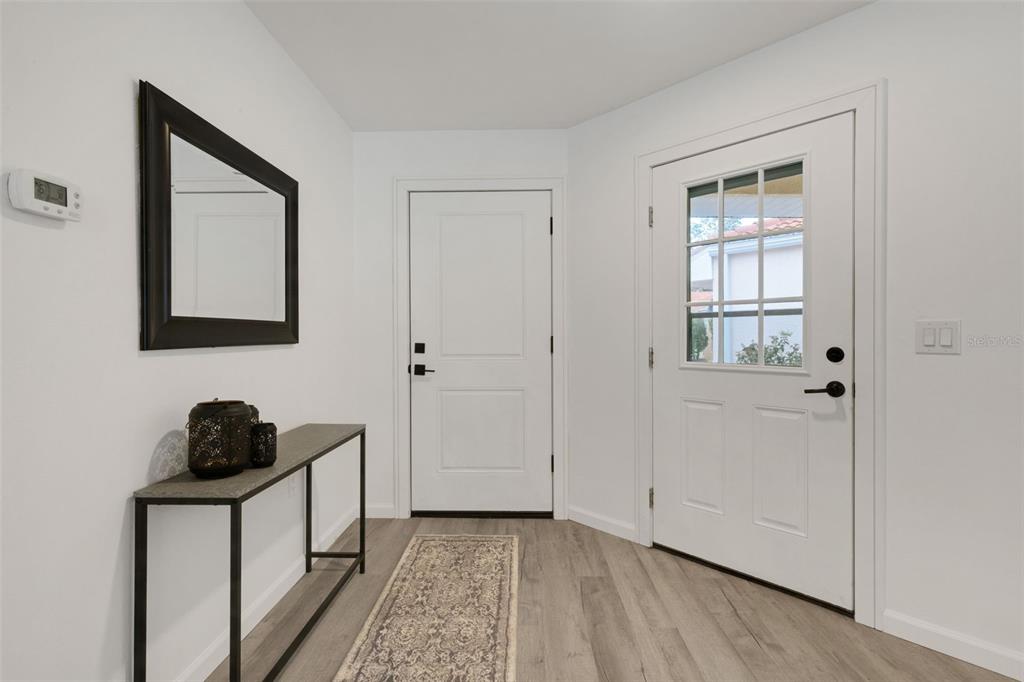 606 Marcus Street, Unit 26 Venice, FL 34285 - Photo 3 of 42 a room that has a bed and a closet in it