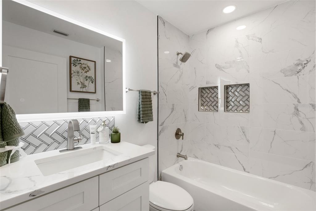 606 Marcus Street, Unit 26 Venice, FL 34285 - Photo 33 of 42 a bathroom with a sink and a bathtub