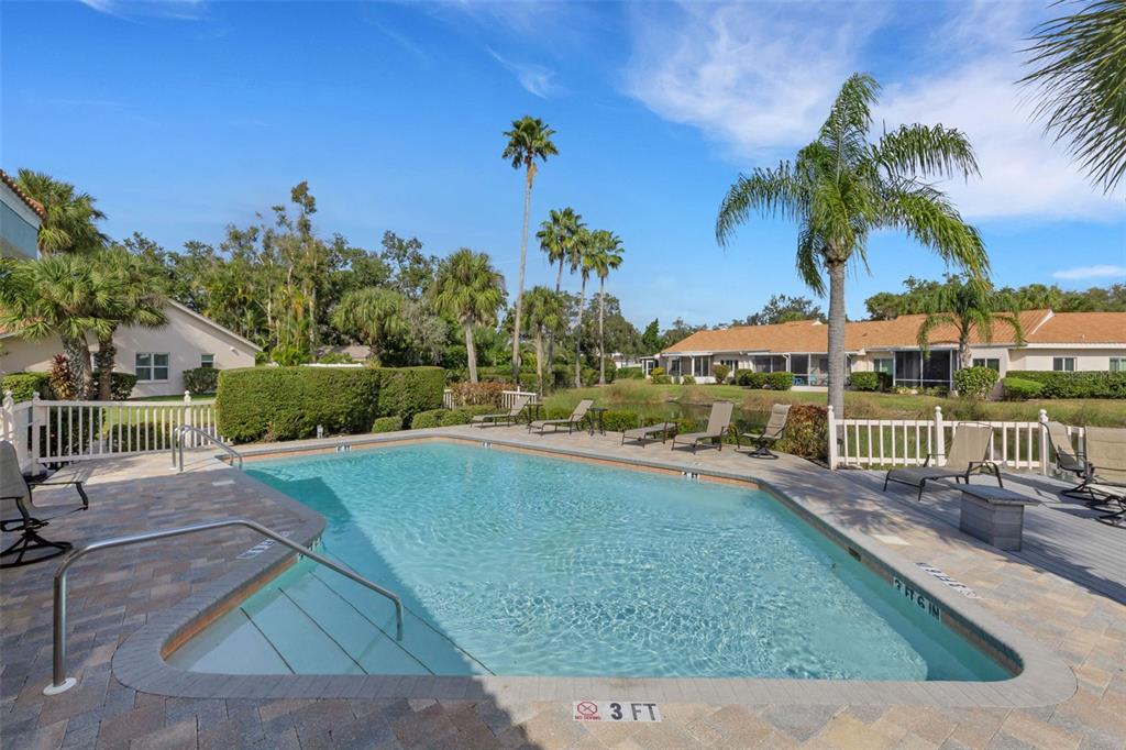 606 Marcus Street, Unit 26 Venice, FL 34285 - Photo 41 of 42 a view of a swimming pool with a yard