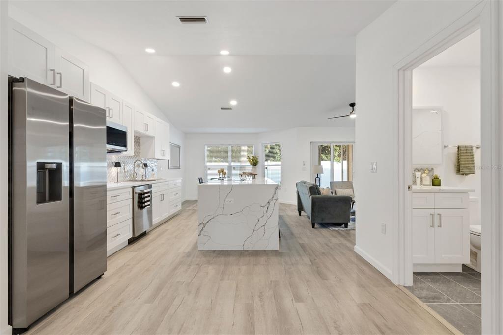 606 Marcus Street, Unit 26 Venice, FL 34285 - Photo 6 of 42 a large white kitchen with cabinets stainless steel appliances