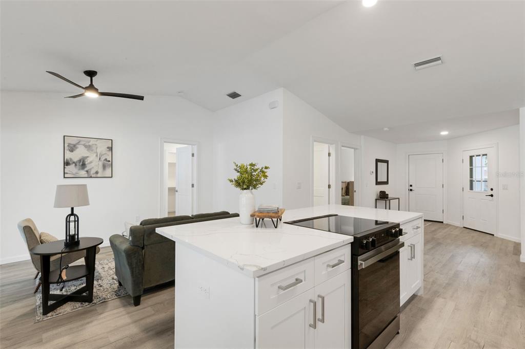 606 Marcus Street, Unit 26 Venice, FL 34285 - Photo 10 of 42 a kitchen with a sink cabinets and wooden floor