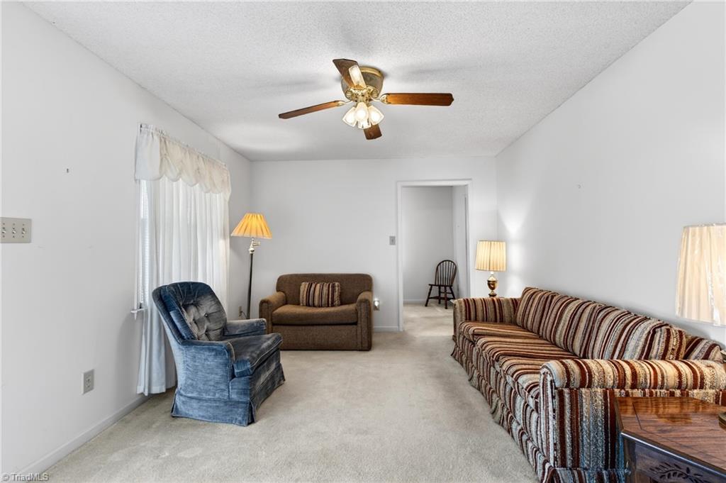 482 Bethany Road Reidsville, NC 27320 - Photo 34 of 49 living room view from hallway to bedrooms