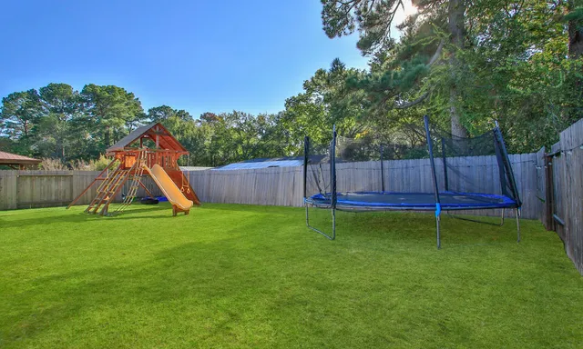 a backyard of a house with lots of green space