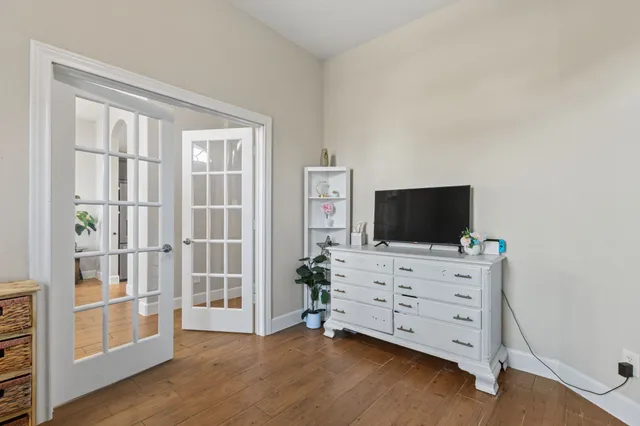a room with furniture and flat screen tv
