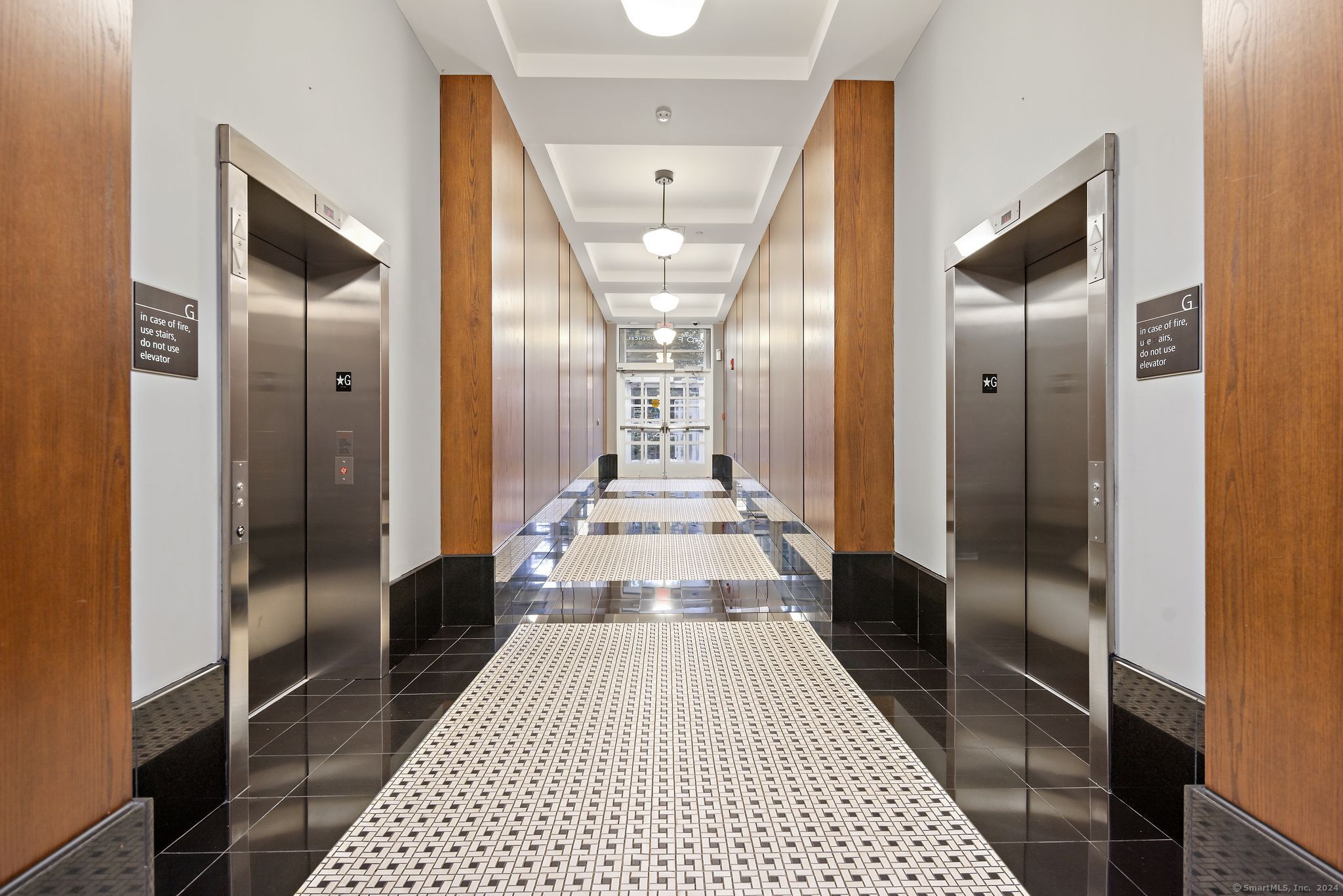 15 Dinah Road, Unit 313 West Hartford, CT 06107 - Photo 24 of 36 a view of a hallway view with wooden floor and a bathroom