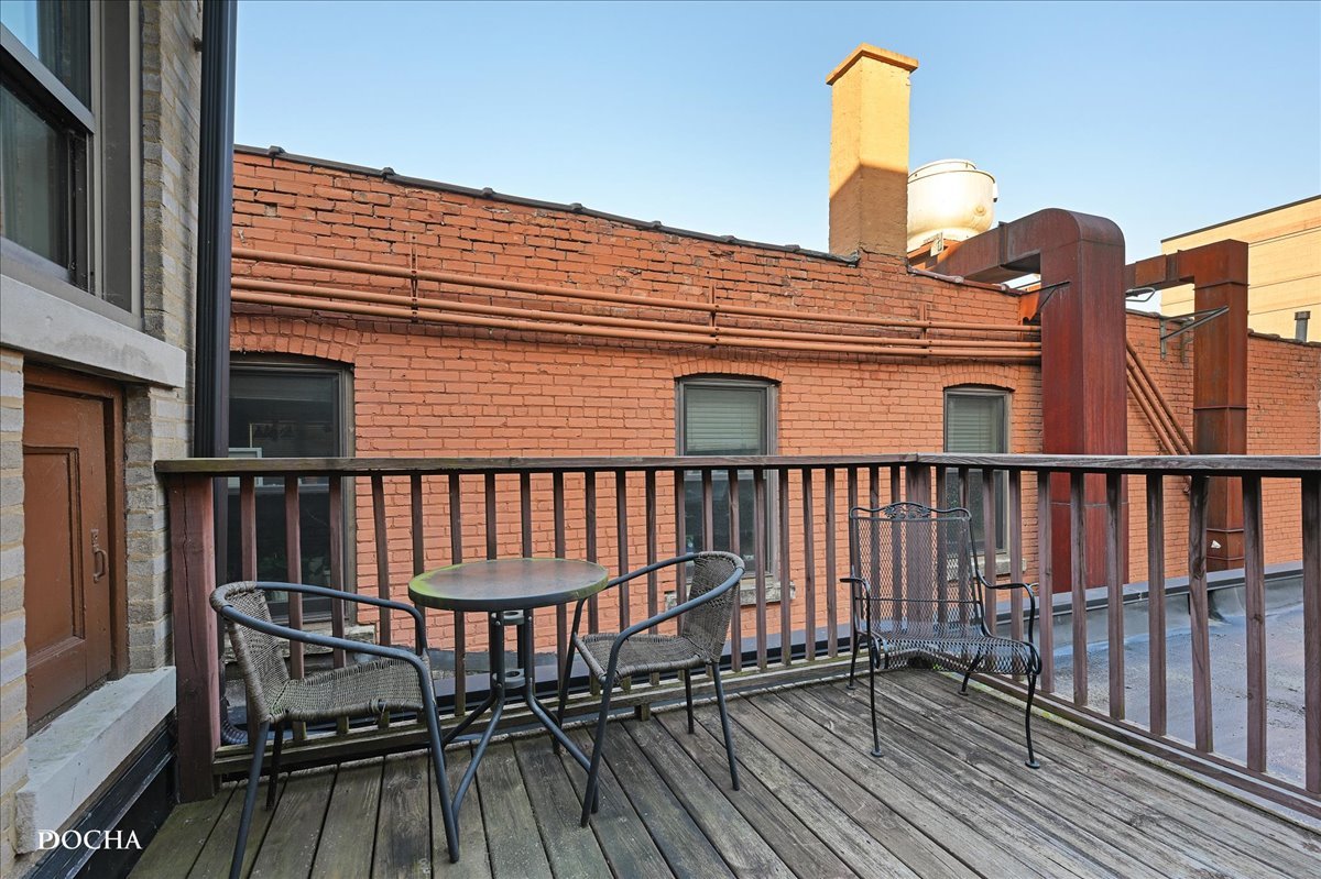 202 West Main Street, Unit 202 St. Charles, IL 60174 - Photo 15 of 17 a view of balcony with wooden floor and iron fence