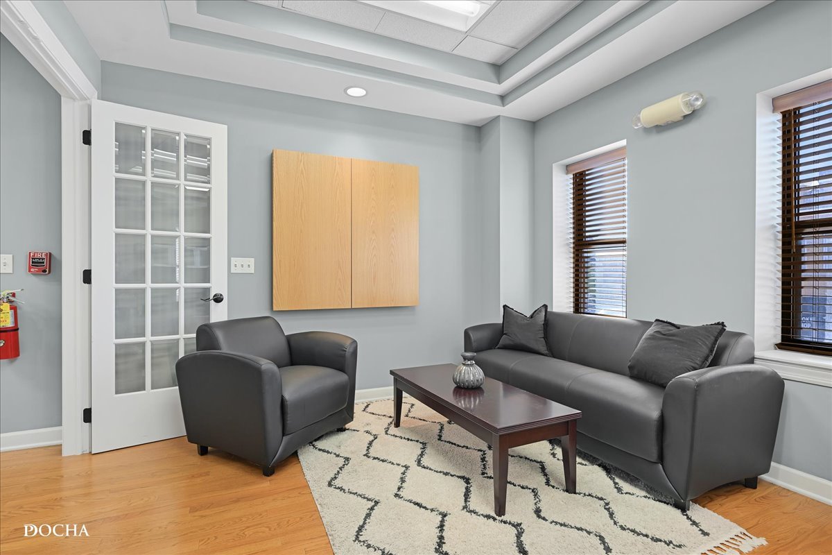 202 West Main Street, Unit 202 St. Charles, IL 60174 - Photo 2 of 17 a living room with furniture and a window