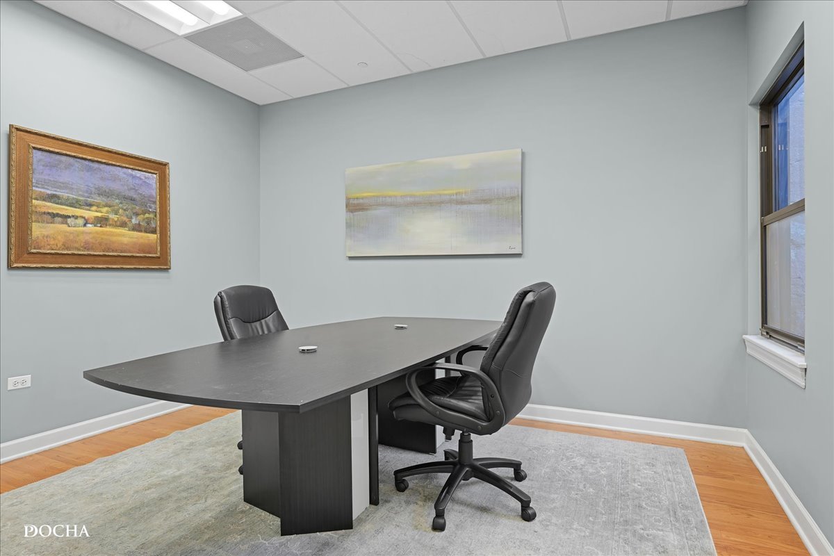 202 West Main Street, Unit 202 St. Charles, IL 60174 - Photo 5 of 17 a workspace with furniture and lamp