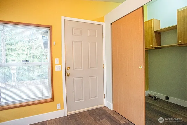 a view of a room that has a window in it