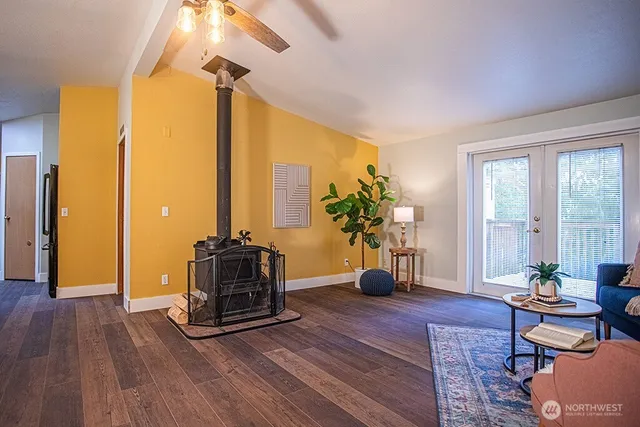 a living room with furniture and a potted plant
