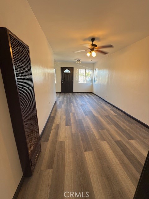 836 West Cedar Street Compton, CA 90220 - Photo 14 of 22 a view of empty room with wooden floor and fan