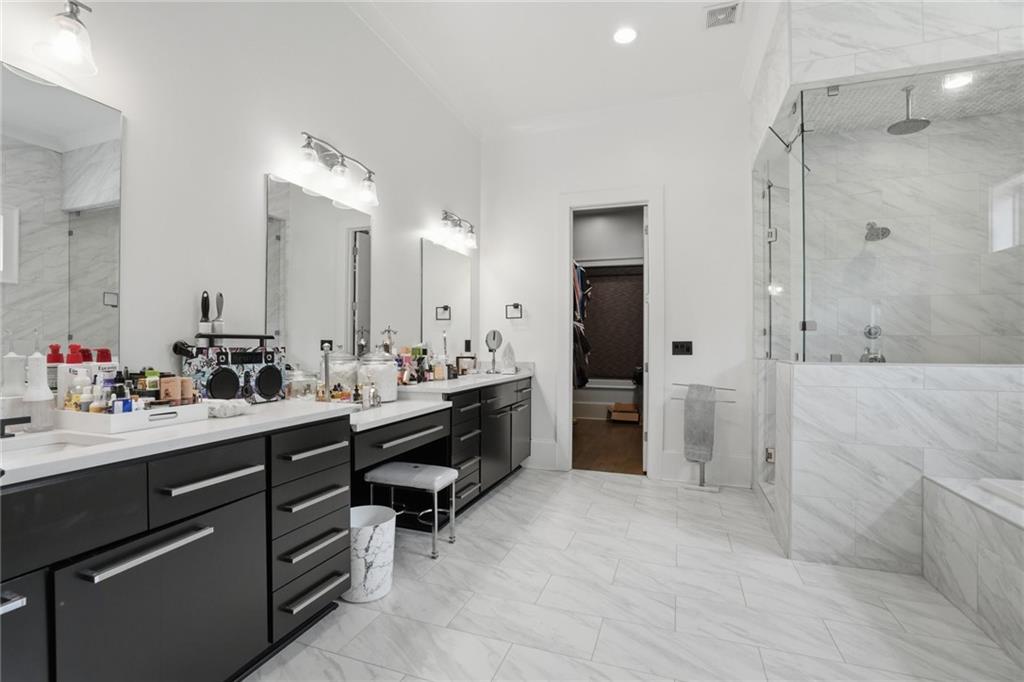 3020 Wallace Road Buford, GA 30519 - Photo 28 of 66 a bathroom with a double vanity sink mirror double and shower