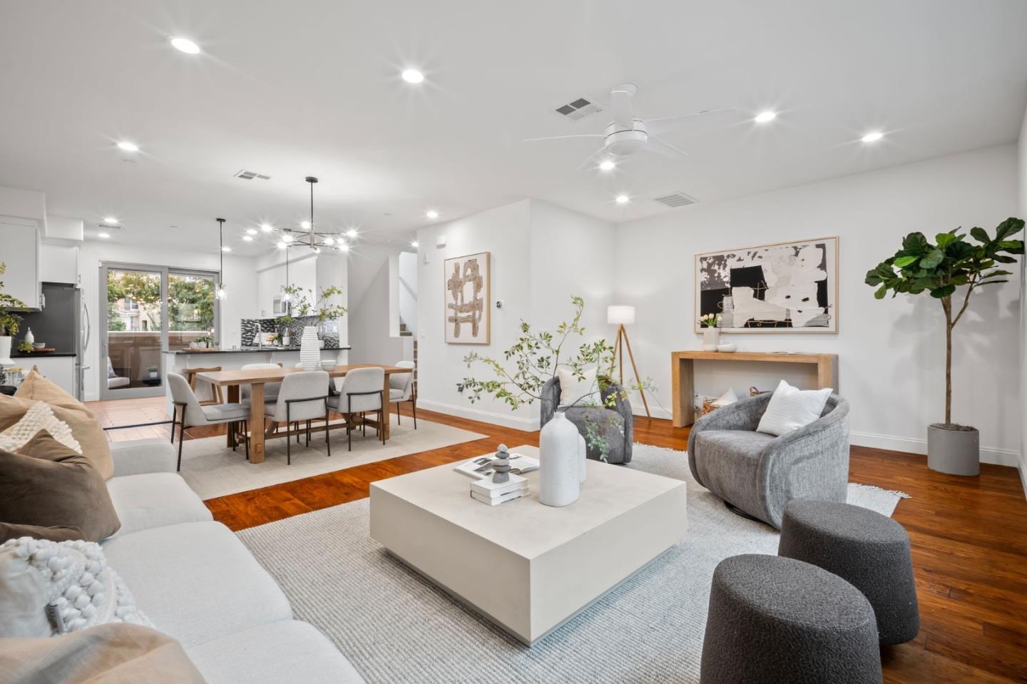 a living room with fireplace furniture and a chandelier
