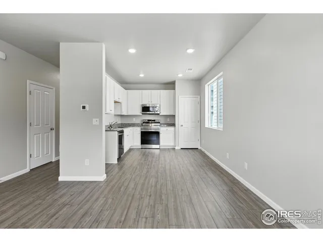 a view of kitchen with wooden floor