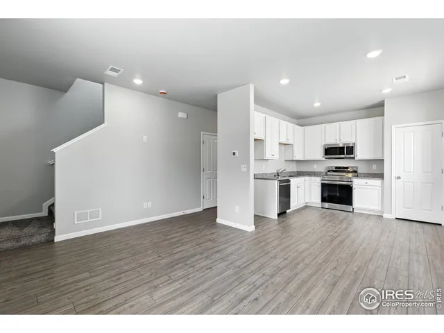 a view of kitchen with wooden floor