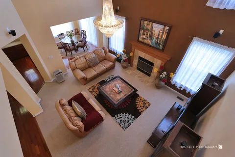a living room with furniture rug and window