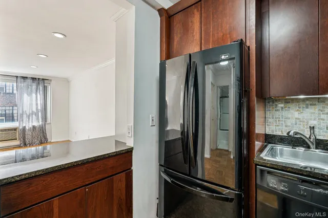 a kitchen with a refrigerator and a sink