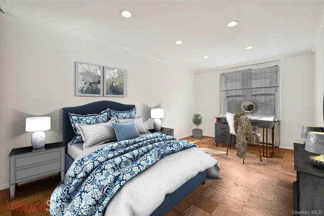 a bedroom with a bed and a lamp