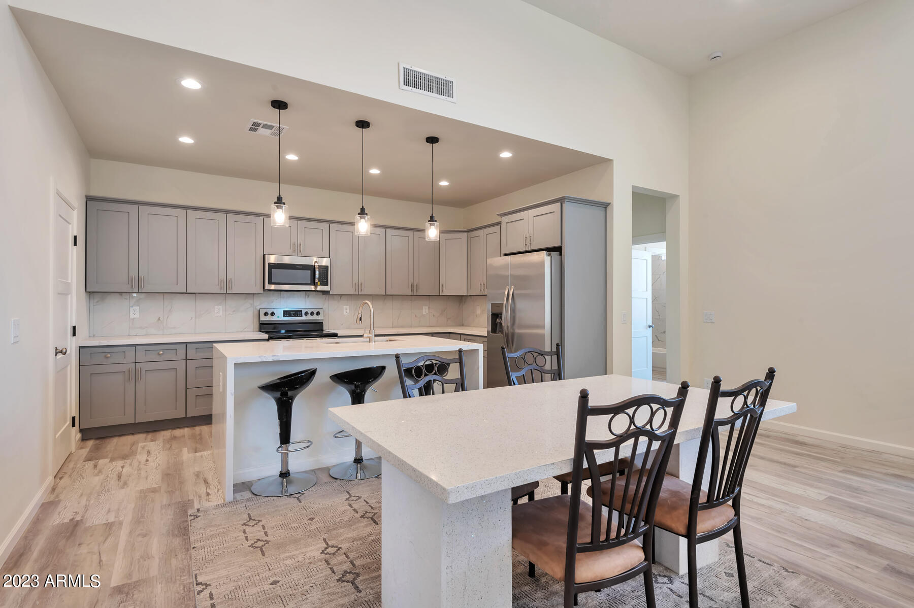 15200 South Diablo Road Arizona City, AZ 85123 - Photo 12 of 23 a kitchen with a table and chairs in it