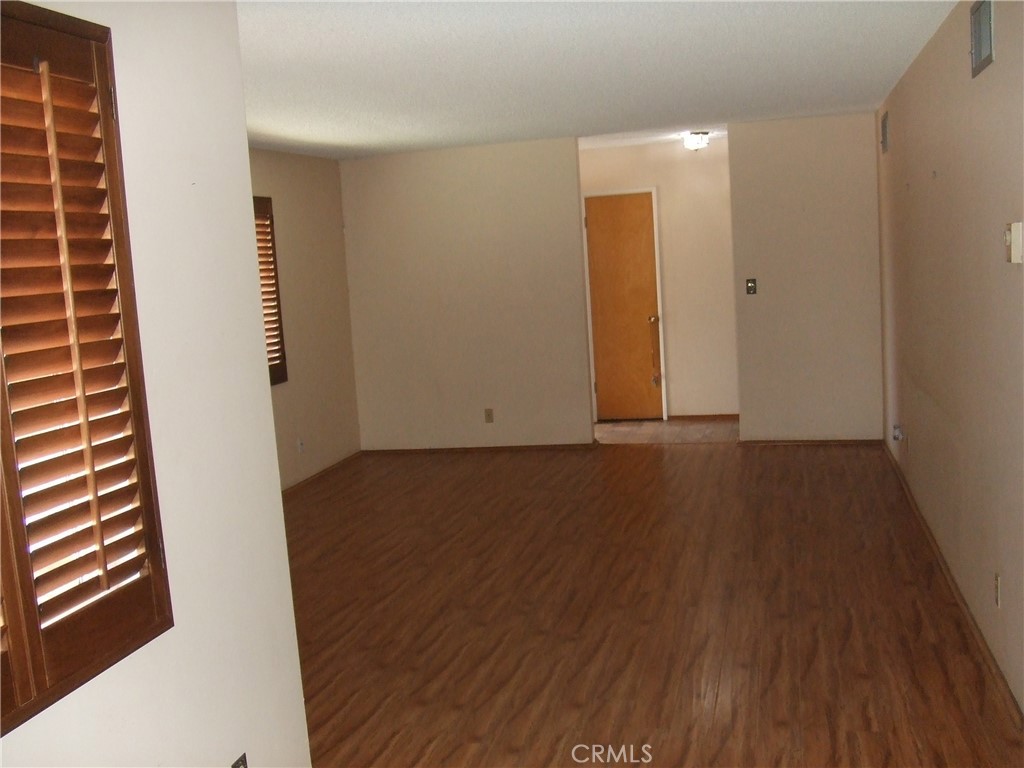 15100 Blackfoot Road Apple Valley, CA 92307 - Photo 3 of 18 wooden floor in an empty room