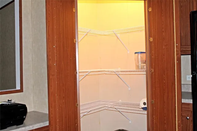 a view of a porch with a table and chairs