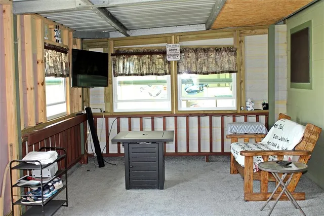 a view of a house with backyard and porch