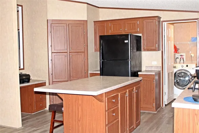 a kitchen that has a stove and a refrigerator