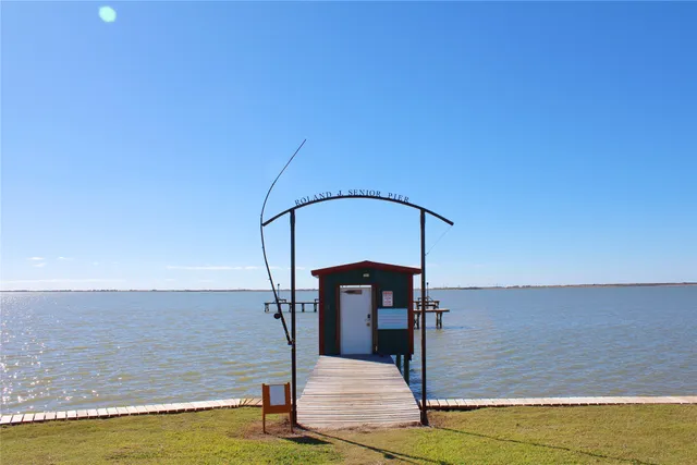 a view of swimming pool with a table and chairs