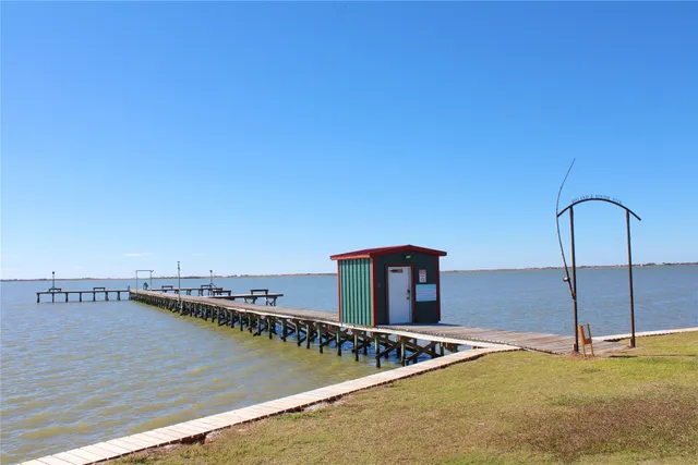 a view of a terrace with a table and chairs