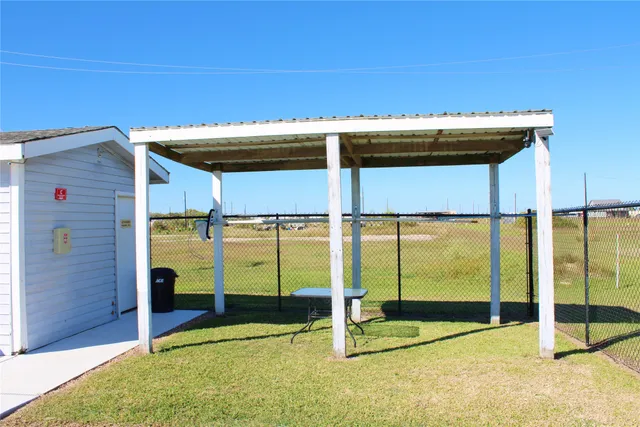 a view of a swimming pool with a chair
