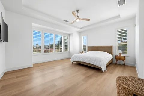 a bedroom with a large bed and a couch