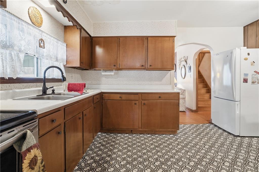 121 Orchard Drive Prospect, PA 16052 - Photo 15 of 46 a kitchen with a sink stove and refrigerator