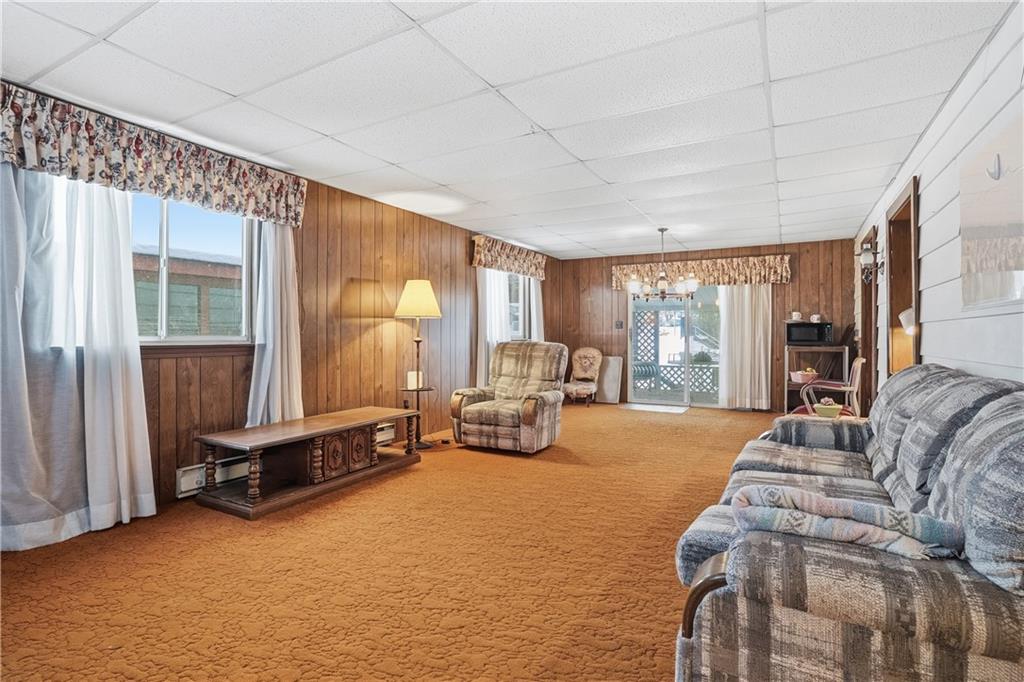 121 Orchard Drive Prospect, PA 16052 - Photo 17 of 46 a bedroom with furniture and large windows