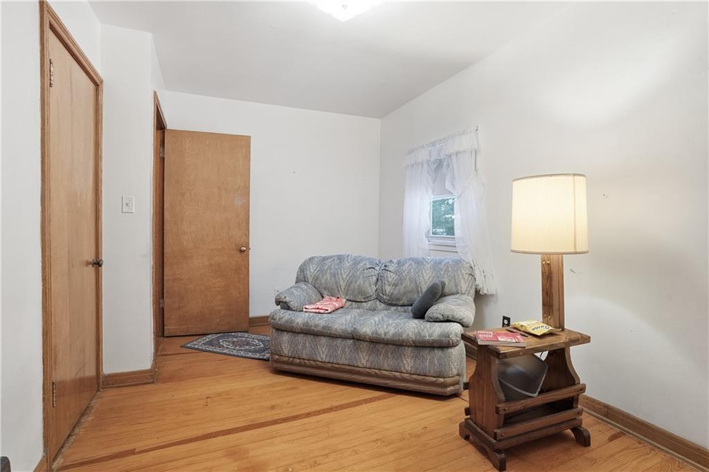 121 Orchard Drive Prospect, PA 16052 - Photo 21 of 46 a living room with furniture and a window