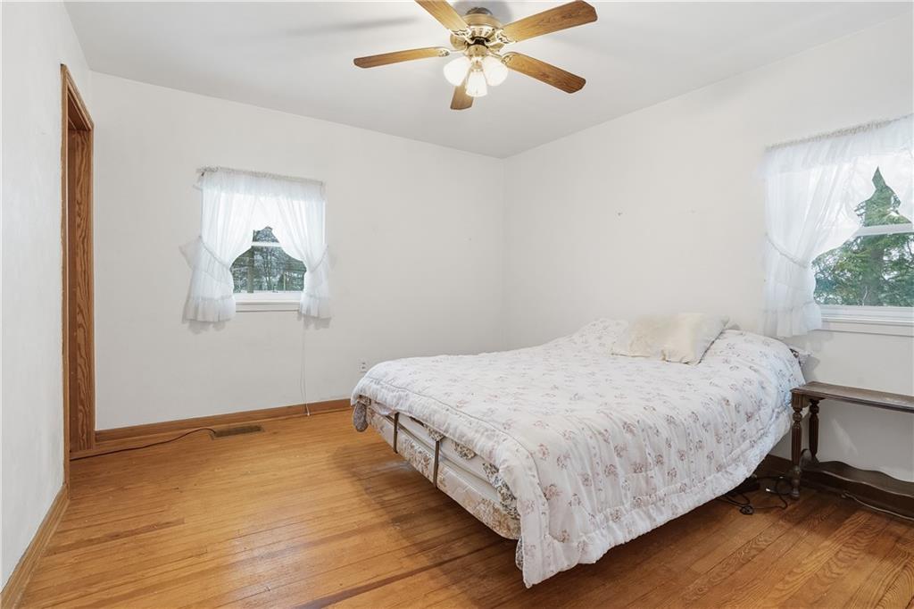 121 Orchard Drive Prospect, PA 16052 - Photo 23 of 46 a bedroom with a bed lamp and a window