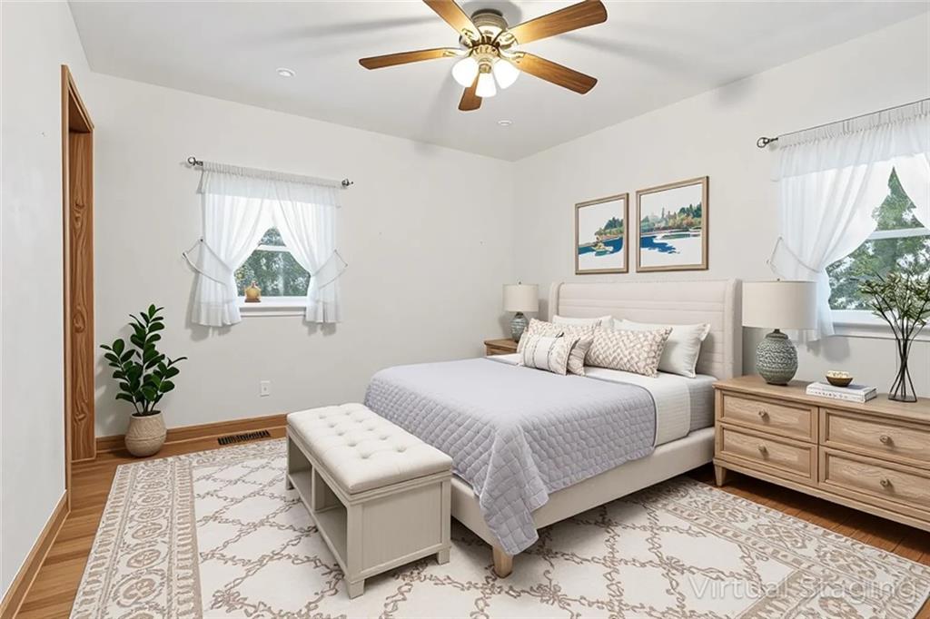 121 Orchard Drive Prospect, PA 16052 - Photo 24 of 46 a bedroom with a large bed and a chandelier