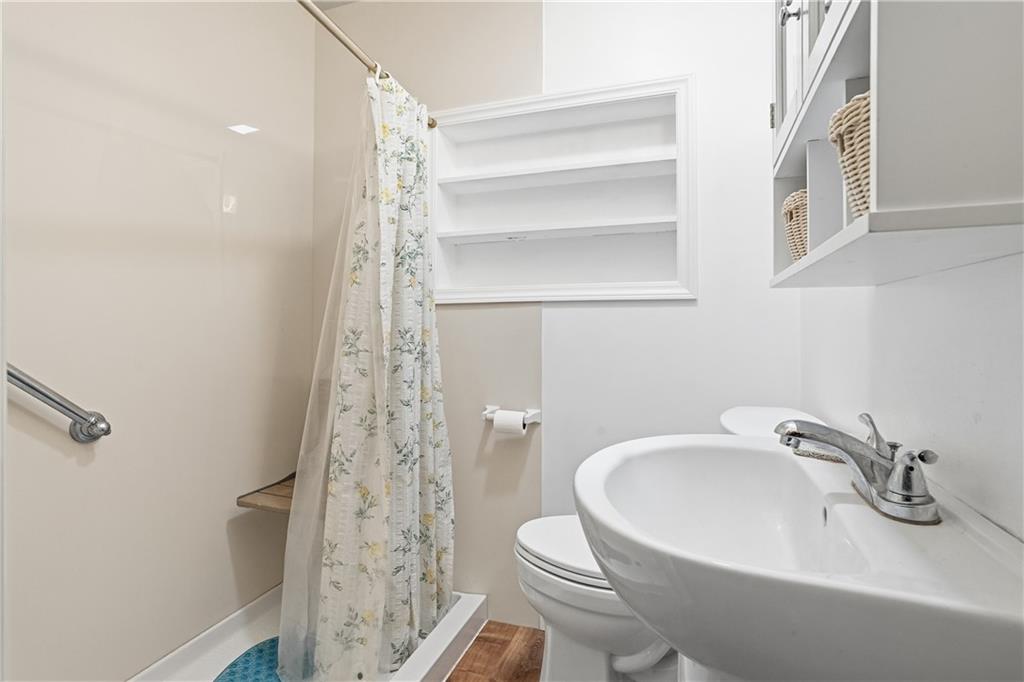 121 Orchard Drive Prospect, PA 16052 - Photo 26 of 46 a bathroom with a sink a toilet and shower