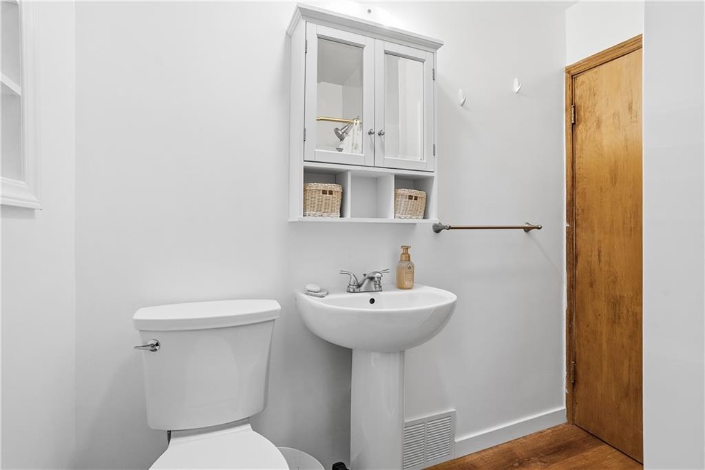 121 Orchard Drive Prospect, PA 16052 - Photo 27 of 46 a bathroom with a sink mirror and toilet