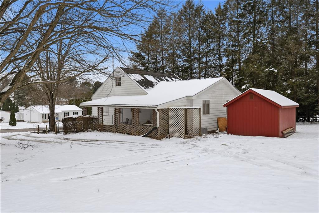 121 Orchard Drive Prospect, PA 16052 - Photo 37 of 46 a front view of a house with a yard covered in snow