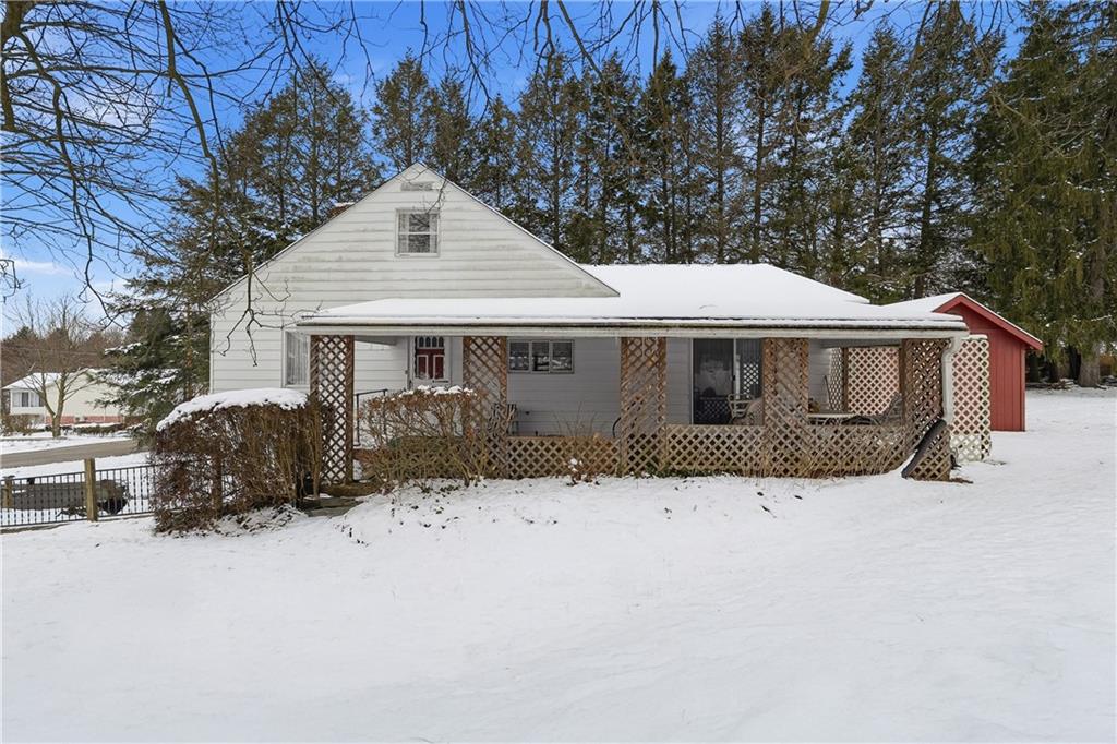 121 Orchard Drive Prospect, PA 16052 - Photo 40 of 46 a front view of a house with a yard covered in snow
