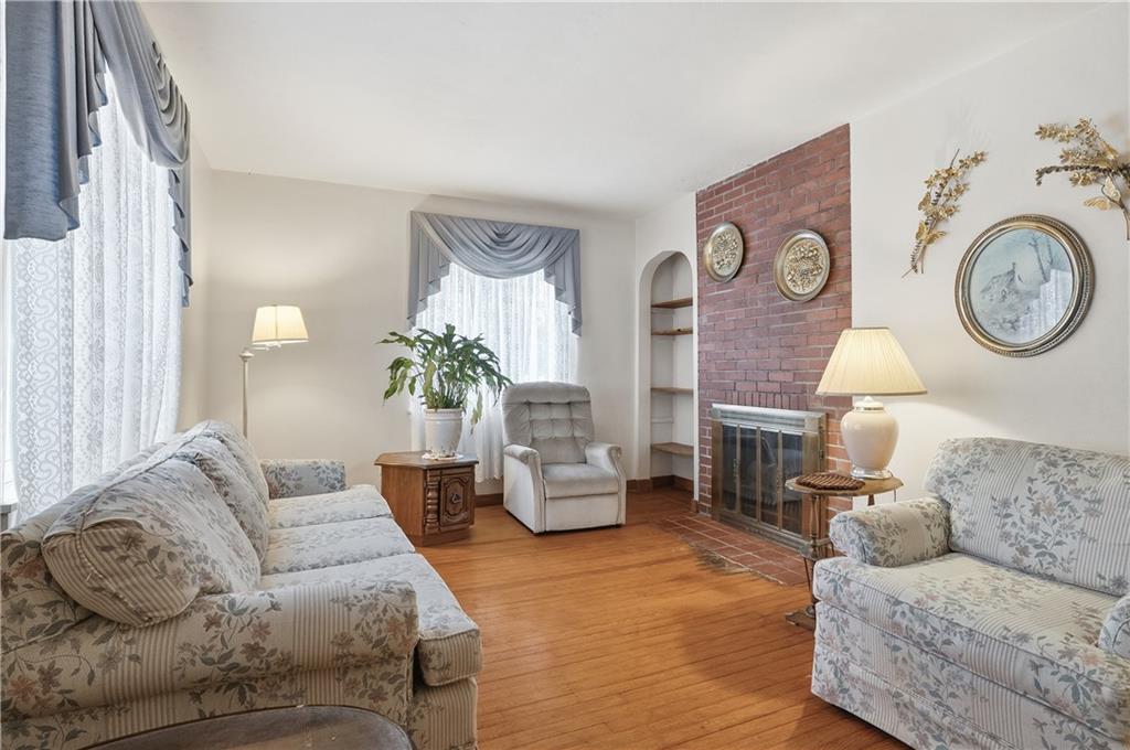 121 Orchard Drive Prospect, PA 16052 - Photo 6 of 46 a living room with furniture and a wooden floor