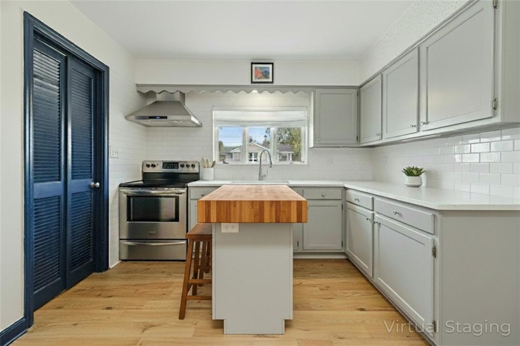 121 Orchard Drive Prospect, PA 16052 - Photo 10 of 46 a kitchen with a sink stove and cabinets