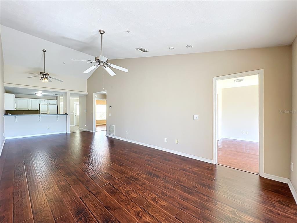 100 Silver Sea Road Winter Springs, FL 32708 - Photo 14 of 44 wooden floor in an empty room with a window
