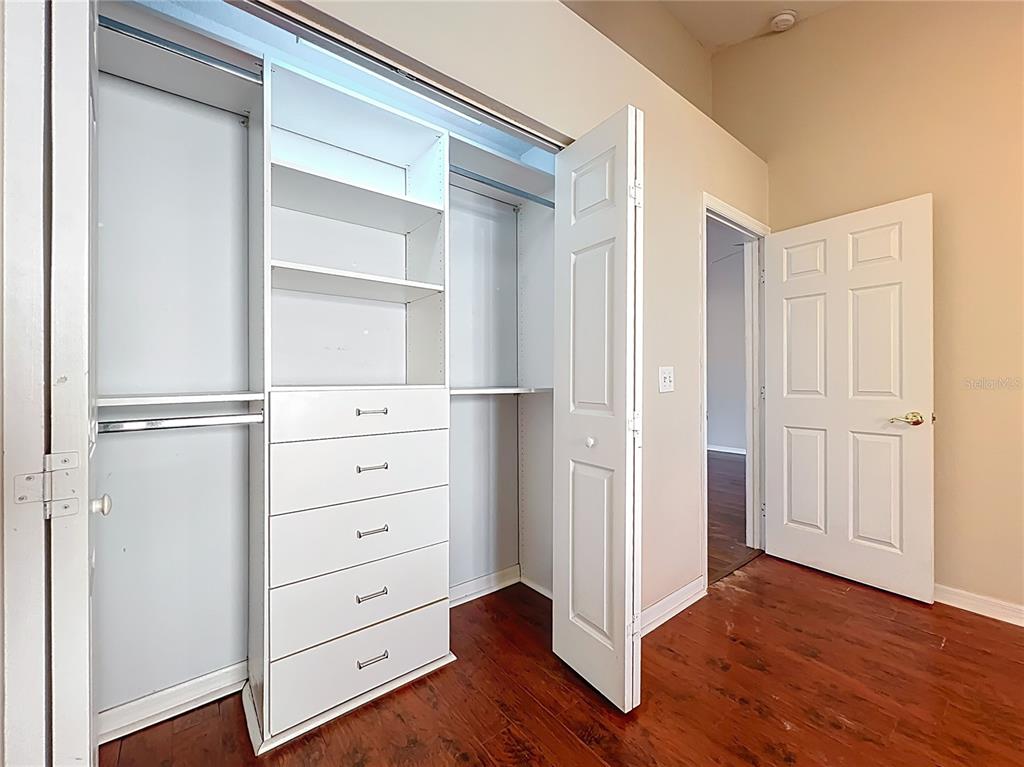 100 Silver Sea Road Winter Springs, FL 32708 - Photo 18 of 44 a view of walk in closet with empty racks