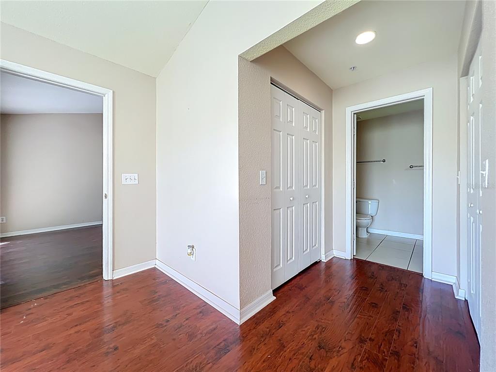 100 Silver Sea Road Winter Springs, FL 32708 - Photo 22 of 44 an empty room with wooden floor & windows and bathroom