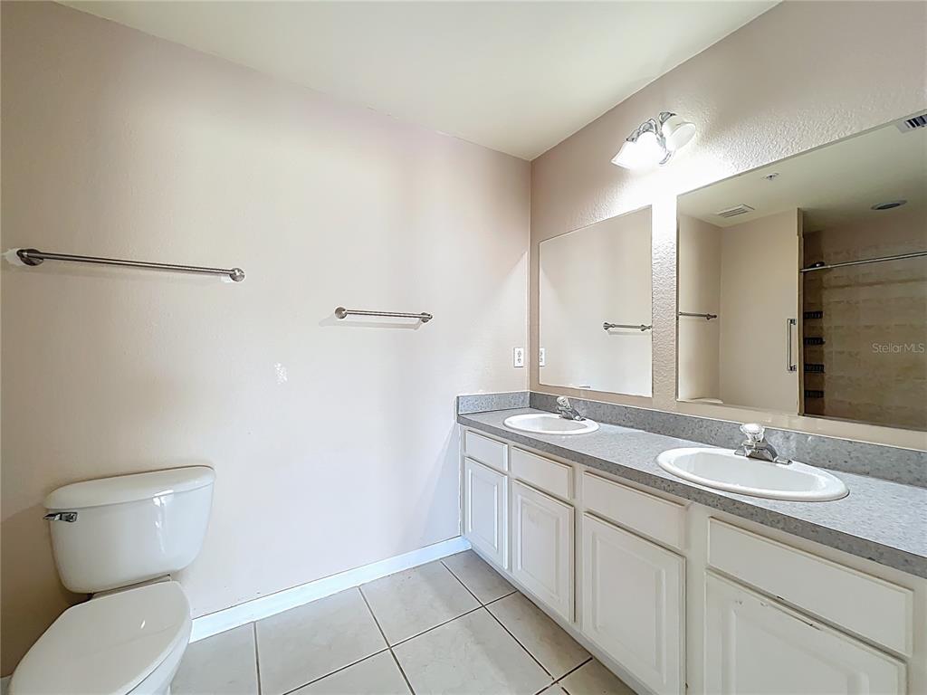 100 Silver Sea Road Winter Springs, FL 32708 - Photo 25 of 44 a bathroom with a granite countertop sink mirror and toilet